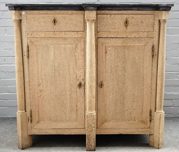 A 19th century Continental bleached oak side cabinet, with faux slate top and turned columns, 131cm wide x 120cm high.