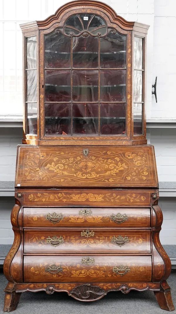 A late 18th century Dutch marquetry inlaid bonnet top bureau bookcase, with bomb three drawer base, 100cm wide x 216cm high.