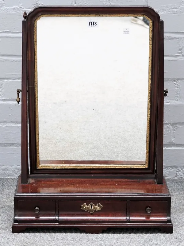 A George II parcel gilt mahogany toilet mirror, with cushion three drawer base, 46cm wide x 65cm high.