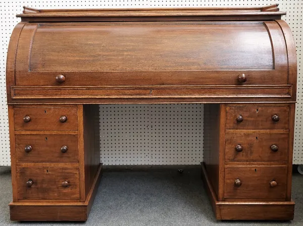 A late 19th century oak cylinder desk with fitted interior over six pedestal drawers, 152cm wide x 120cm high.