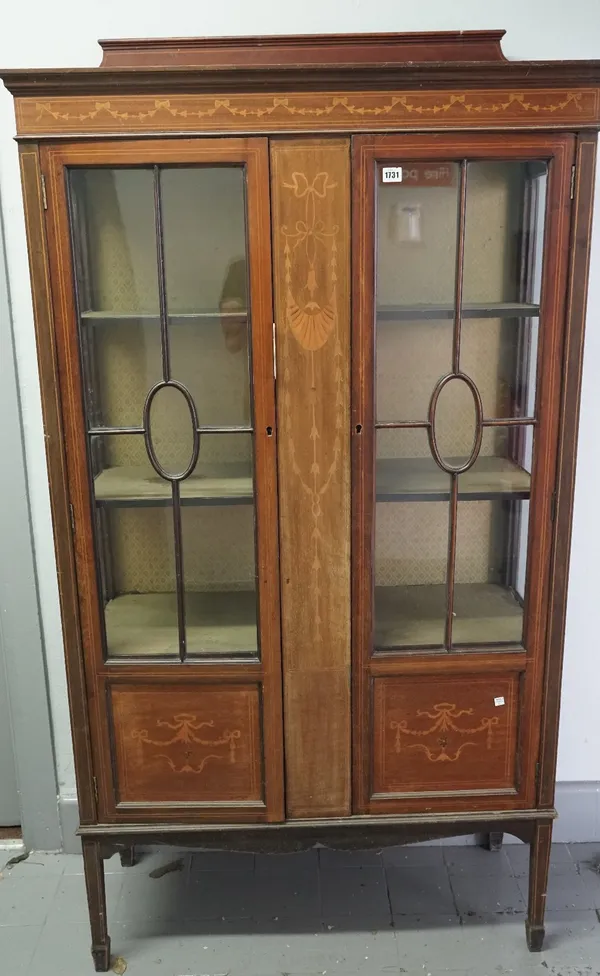 An Edwardian marquetry inlaid mahogany two door display cabinet, on square supports, 98cm wide x 173cm high.