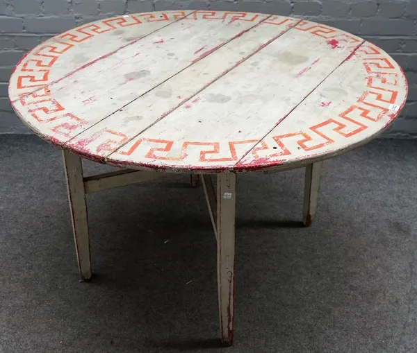 A 19th century Continental painted pine circular table, on folding base, 112cm diameter x 70cm high.