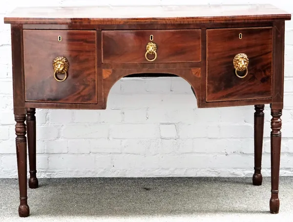 A late George III mahogany bowfront sideboard, with three frieze drawers on turned supports, 120cm wide x 87cm high.