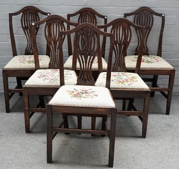 A set of six 18th century oak pierced splat back dining chairs, on tapering square supports, 48cm wide x 100cm high.