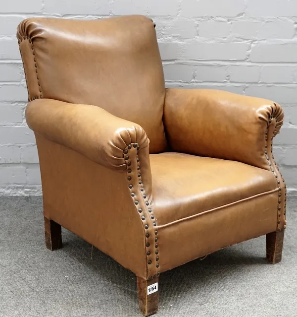 A mid-20th century child's brown leatherette upholstered club armchair, on block supports, 62cm wide x 68cm high.