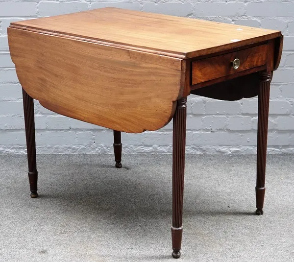 A Regency mahogany Pembroke table, with end frieze drawer on tapering reeded supports, 88cm wide x 77cm high.