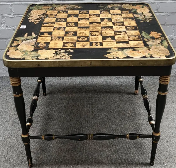 A Victorian and later square games table, the black and gilt chessboard top on turned supports, 62cm wide x 56cm high.