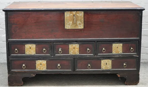 A 19th century Indian brass mounted teak mule chest, the lift top over five drawers on bracket feet, 138cm wide x 80cm high.