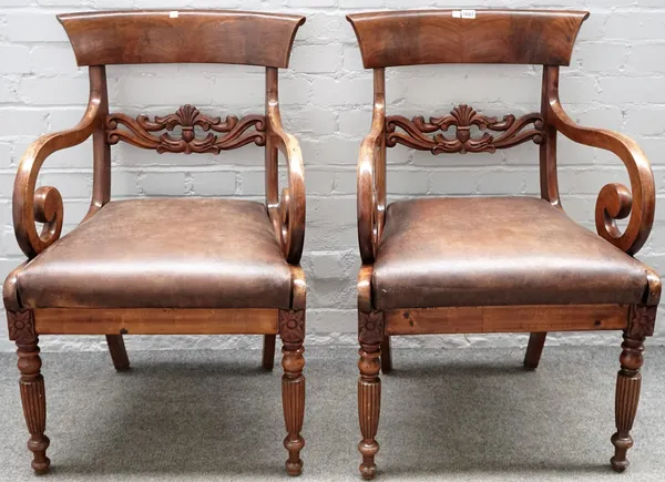 A pair of early Victorian style mahogany carver chairs, with carved waist rail on reeded supports, 58cm wide x 90cm high.