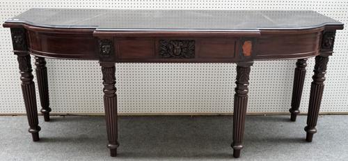 A William IV mahogany serving table, the marble top over three frieze drawers on reeded supports, 234cm wide x 98cm high.