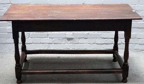 A 17th century oak refectory table, with end frieze drawer on turned supports united by a perimeter stretcher, 142cm wide x 74cm high.