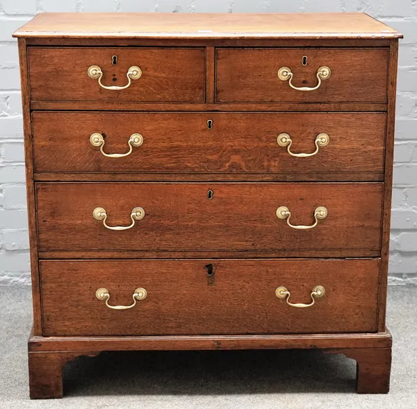 A George III oak chest, with two short over three long graduated drawers on bracket feet, 92cm wide x 95cm high.