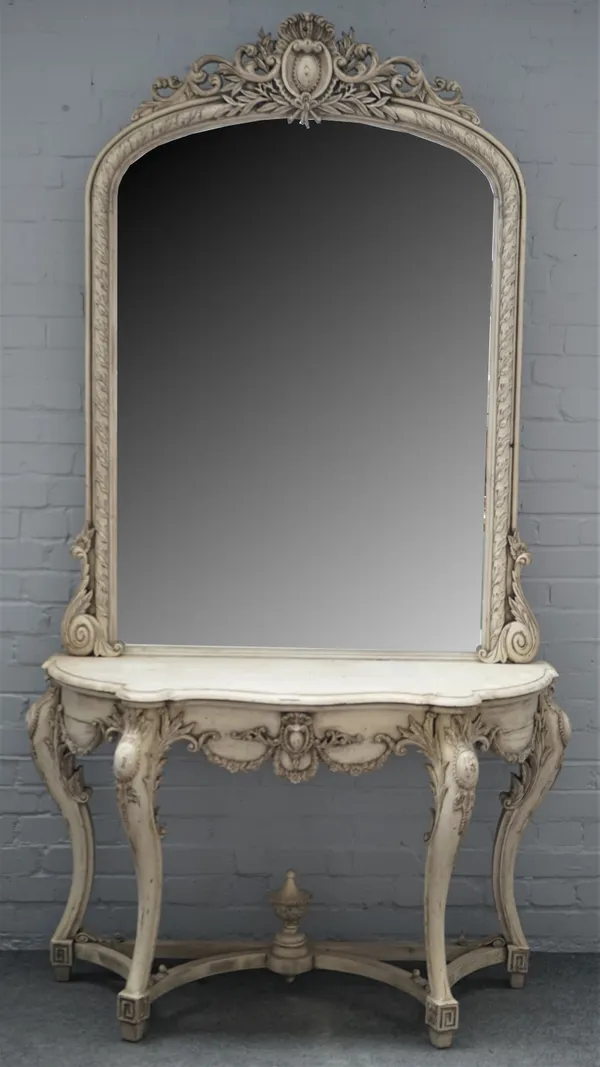 A white painted Victorian style arch top mirror, with cartouch crest and matching seprentine console, 125cm wide x 230cm high.