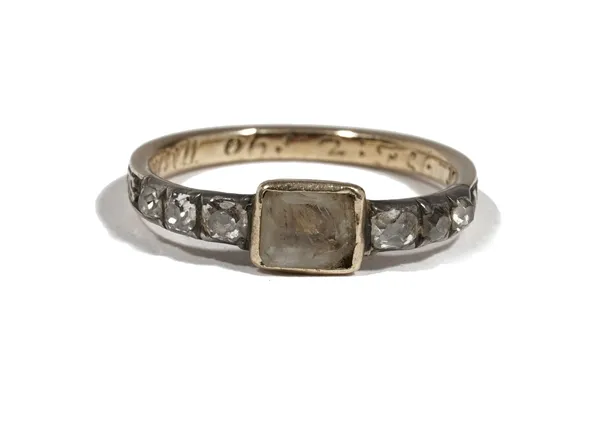 A Georgian yellow precious metal mourning ring, set with a central plaque between diamond set shoulders, 'M Aubrey O.B. 21 Jan 1726 A.E 78' ring size