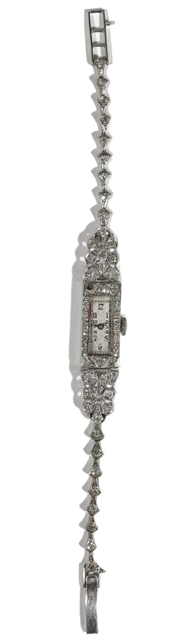 A lady's diamond set cocktail bracelet watch, the dial with Arabic numerals, the inside back of case detailed 'all platinum', the buckle detailed 9ct,