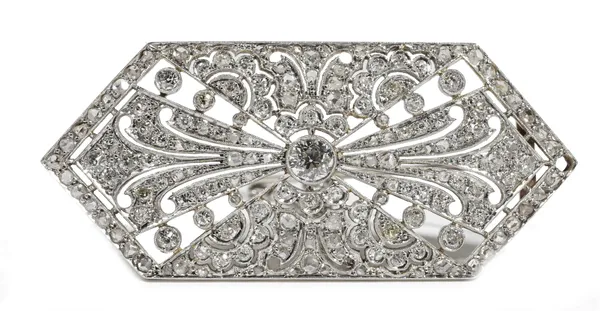 An Art Deco style diamond-set brooch of lozenge shaped plaque design, the principal circular-cut diamond weighing approximately 0.50ct, milligrain-set