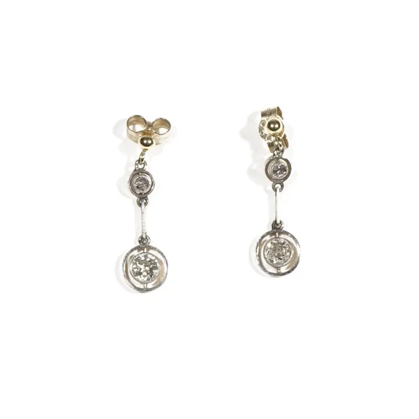 A pair of diamond pendant earrings, the yellow precious metal earstuds, suspending circular-cut diamonds further suspending circular-cut diamonds in o