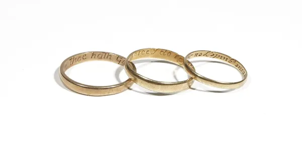 A yellow precious metal band ring, inscribed to the inner band 'Happy in thee hath God made me' ring size U, another inscribed to the inner band 'In t