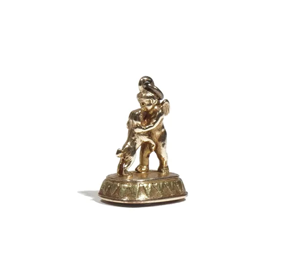 A 19th century foil backed amethyst set yellow precious metal fob seal, designed as a cherub kissing a dog on its hind quarters, the amethyst fob inta