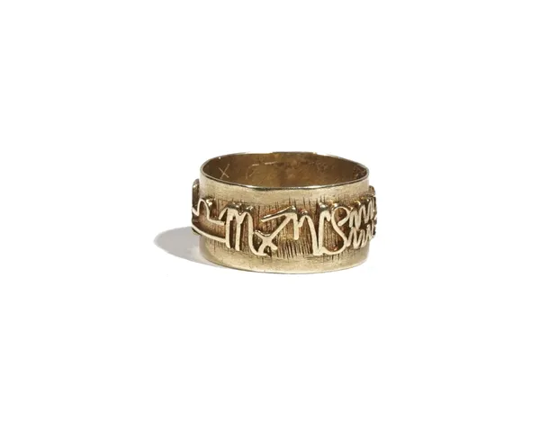 A yellow precious metal band ring, applied with zodiac symbols, to a textured band, ring size O, 5.6g.