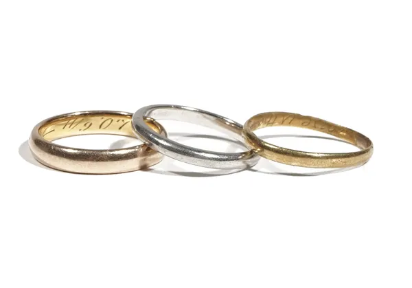 A 14ct gold band ring, inscribed to the inner band, ring size P, another yellow precious metal ring inscribed to the inner band 'Love is the bond of p