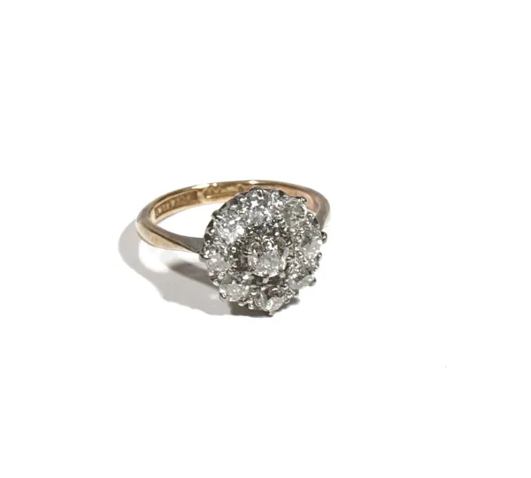 An 18ct gold and platinum, diamond-set nine stone cluster ring, the old mine-cut diamonds, approximate total diamond weight 0.75ct, ring size M, 3.9g