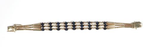 A sapphire and diamond-set triple row bracelet, set with alternating oval-cut claw-set sapphires, between diamond-set three stone gold  links, with gr