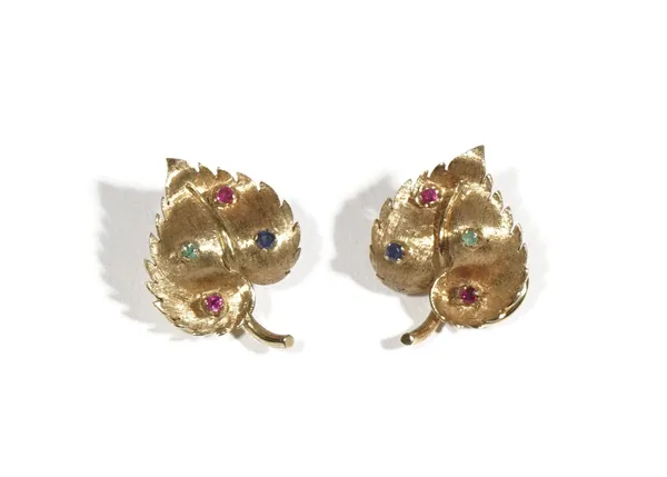 A pair of coloured gemstone set earclips, of leaf design, set with circular-cut emeralds, rubies and sapphires, to a textured ground, the clips detail