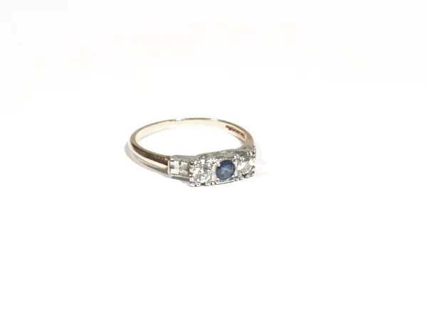 A gold, sapphire and diamond three-stone ring, the central circular-cut sapphire, between two similar sized circular-cut diamonds, claw set to a white