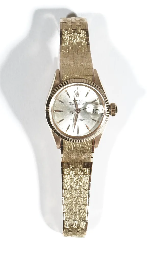 Rolex; an 18ct gold Lady Datejust bracelet wristwatch, the silvered dial with gilt baton indicators and date aperture to three o'clock, to an automati