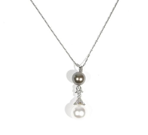 An 18ct white gold, black cultured pearl and diamond-set pendant necklace, designed with a black cultured pearl suspending a diamond-set link, collet-