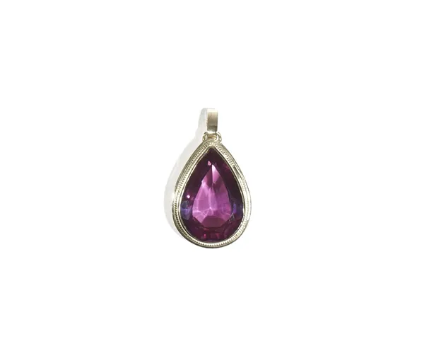 A gold pendant, mounted with a pear shaped synthetic corundum imitating alexandrite. detailed 585.