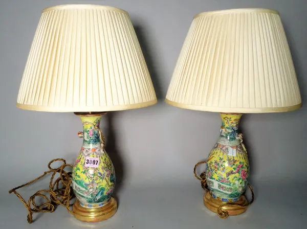 A pair of 20th century Chinese porcelain table lamps and shades, 48cm high, (2).