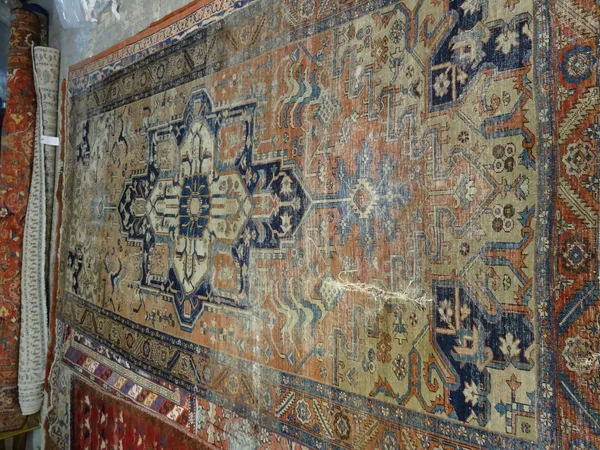 A Tabriz carpet, the madder field with large medallion, 320cm x 161cm.