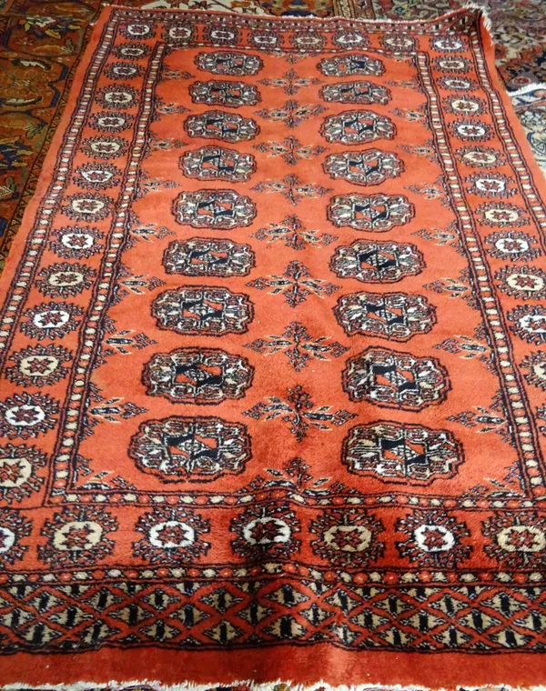 An Indian Bokhara rug, with madder field, 116cm x 80cm.