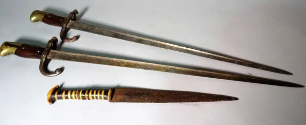 Two early 20th century French bayonets and an African knife, (3).