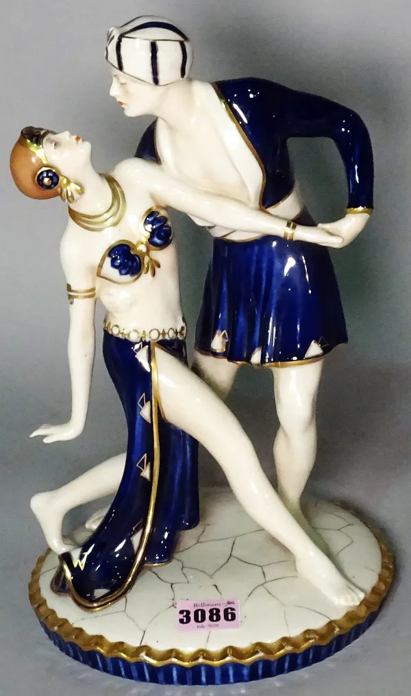 A Royal Dux figure group depicting dancers in blue, 33cm tall.