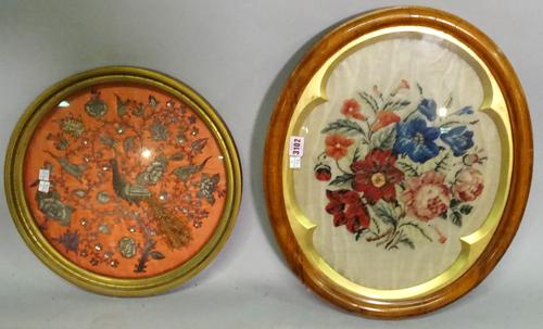 An early 20th century walnut and parcel gilt framed woolwork floral display, 50cm wide x 43cm high, and a Victorian Indian style bead work depicting a