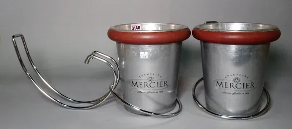 'Mercier', a pair of modern stainless steel champagne buckets with table holders, 22cm wide x 22cm high, (4).