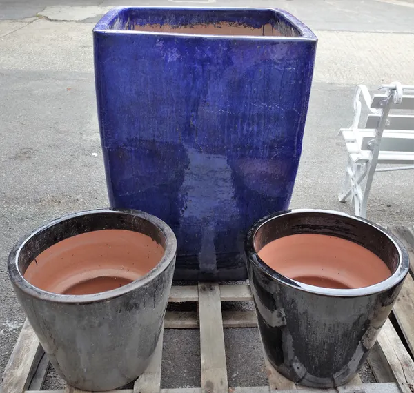 A modern large square garden pot, 65cm wide x 91cm high, and a smaller pair of garden pots, 44cm wide x 37cm high (3).