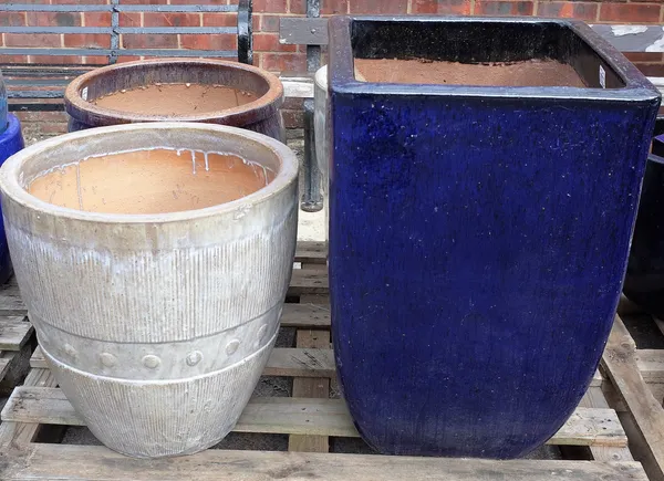 A pair of modern garden pots, 51cm wide x 52cm high and another similar, and a modern square garden pot, 47cm wide x 72cm high (4).