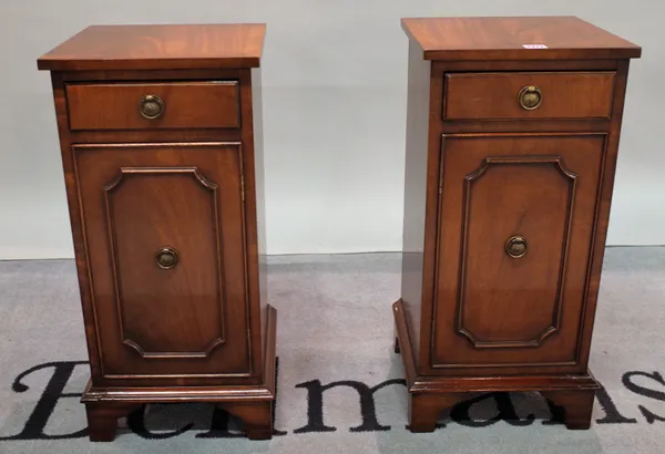 A pair of modern mahogany single drawer bedside cupboards on bracket feet, 32cm wide x 68cm high, (2).