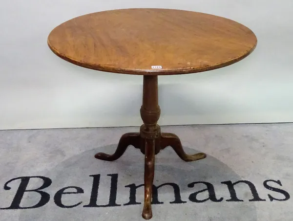 A George III mahogany tripod table on turned column with downswept pad feet, 82cm wide x 88cm high.