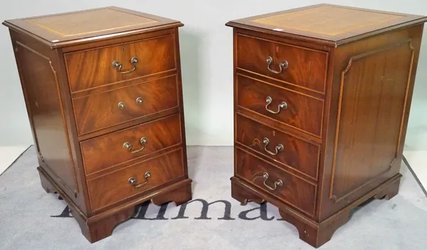 A pair of 20th century stained beech two drawer filing cabinets with inset tan leather tops, 51cm wide x 78cm high.