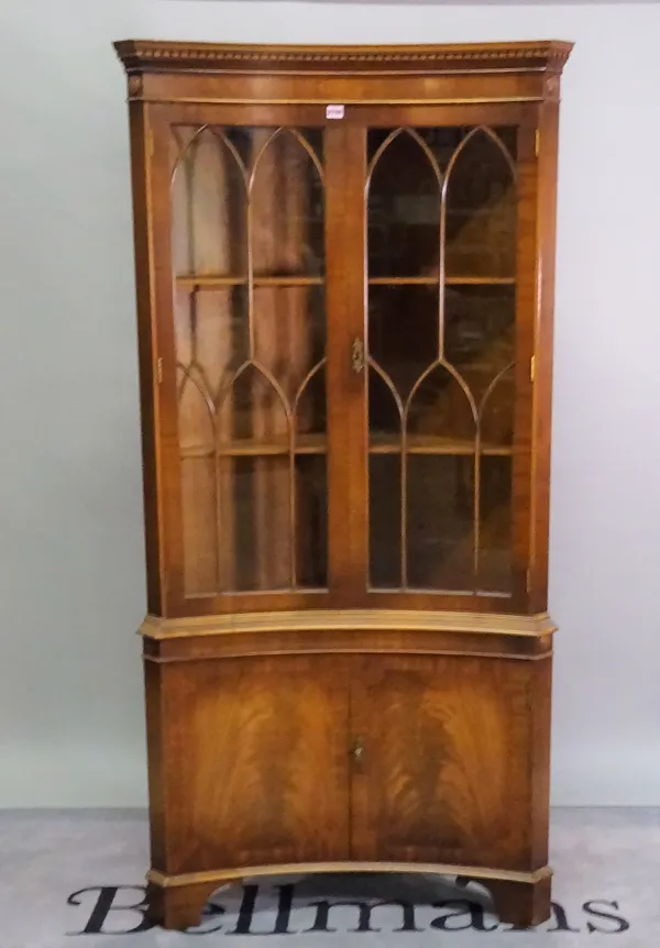 A Regency style mahogany concave corner display cabinet, 91cm wide x 188cm high.