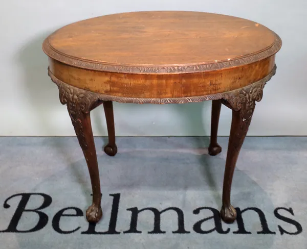 A Victorian style mahogany oval centre table on ball and claw supports.