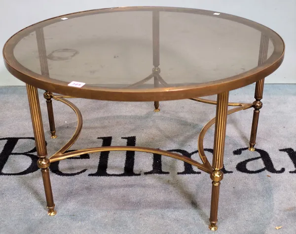 A mid-20th century brass and circular glass coffee table, 77cm diameter x 40cm high.