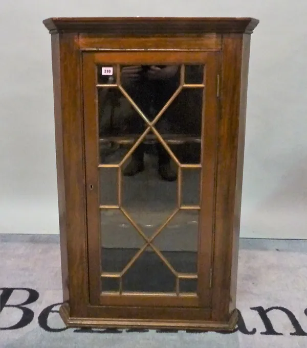 A 19th century mahogany corner cabinet with astragal glazed door, 67cm wide x 102cm high.