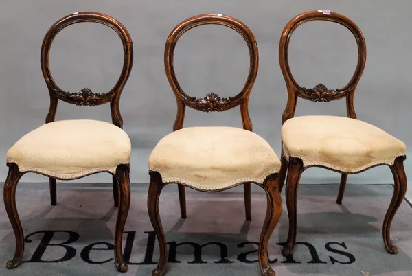 A set of six 19th century walnut balloon back dining chairs on cabriole supports, (6).