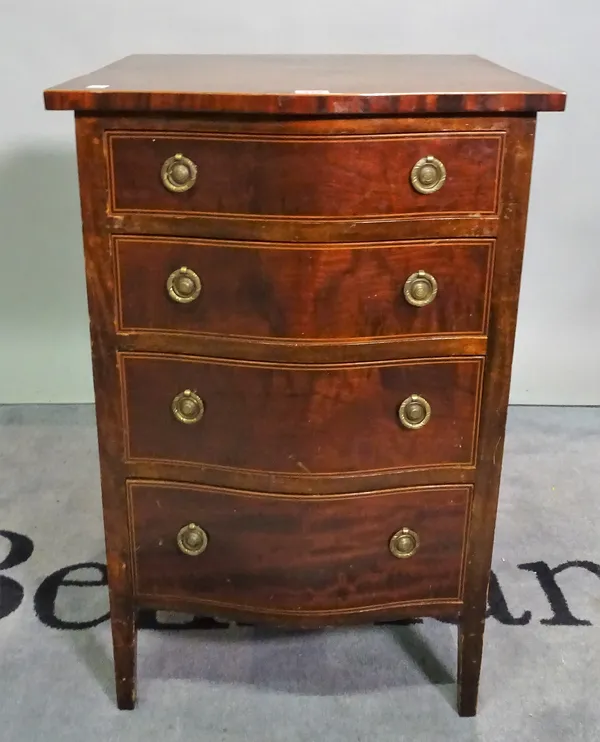 A Regency style mahogany serpentine chest of four short drawers on tapering supports, 50cm wide x 78cm high.